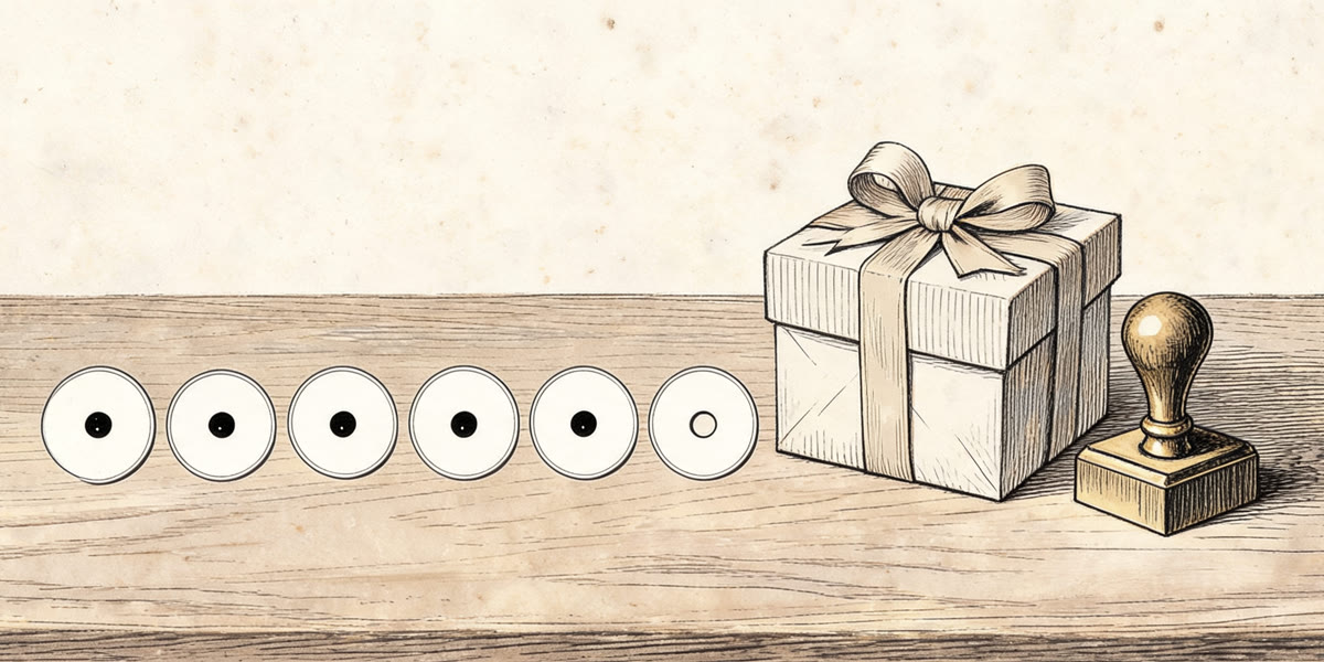 Pencil sketch of a punch card, a gift box and a stamp on a desk